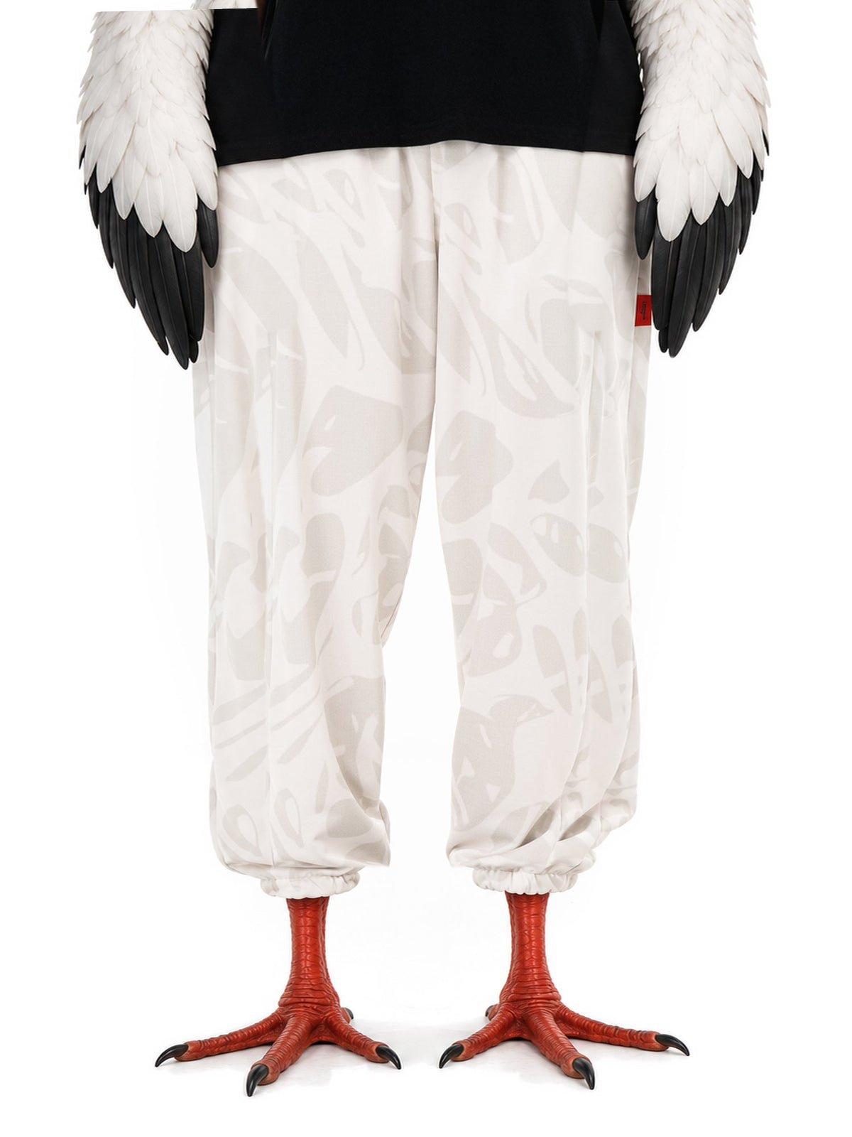 Invented character, white stork, wearing Strand Ivory Joggers