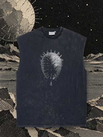 The black Needle Core tank top on a plain of grey paper, in front of a large pale paper sphere full of silver pins.