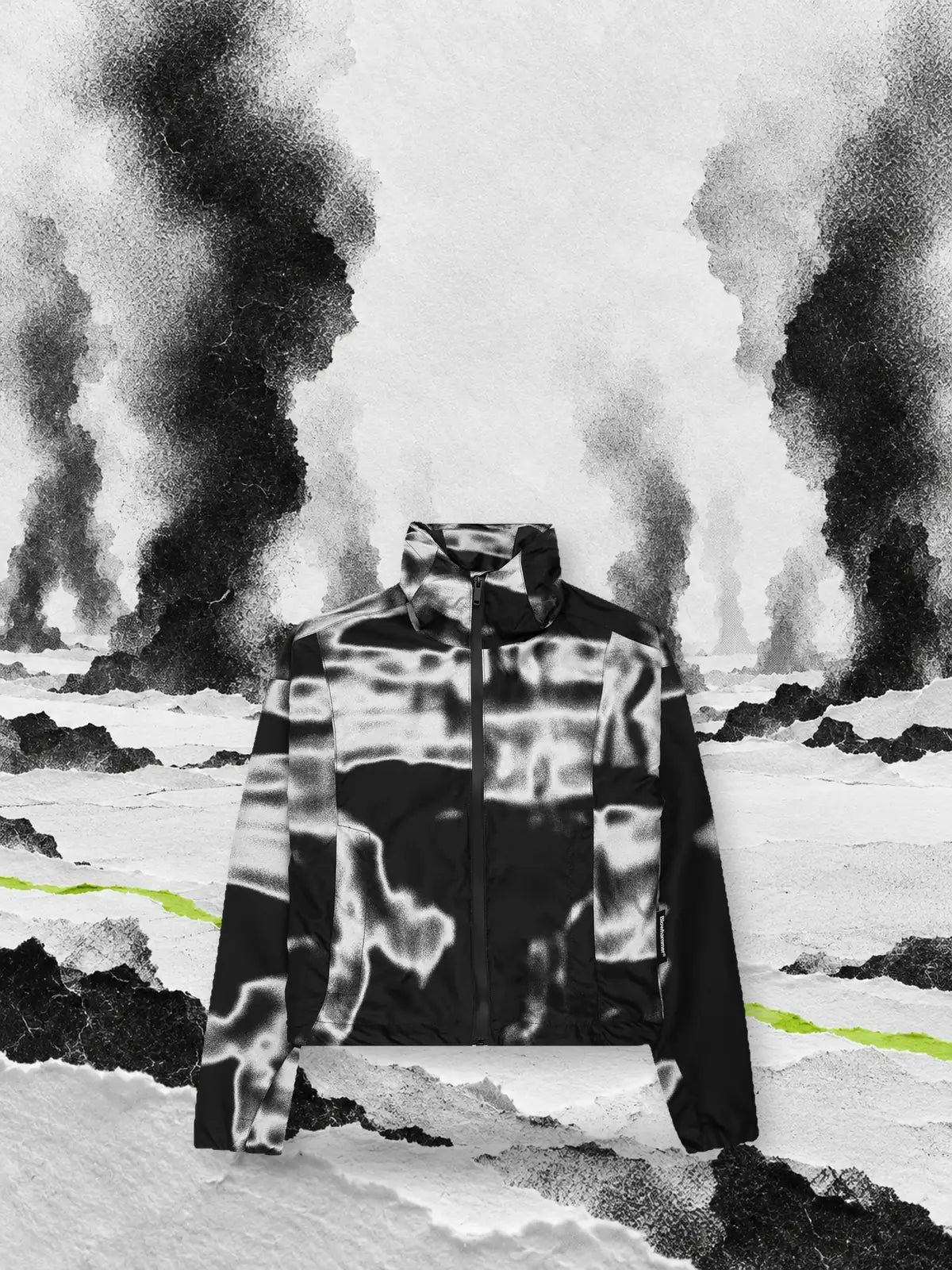 The black and white Rift windbreaker in a snowfield of paper with columns of black smoke and a lime green line on the ground.