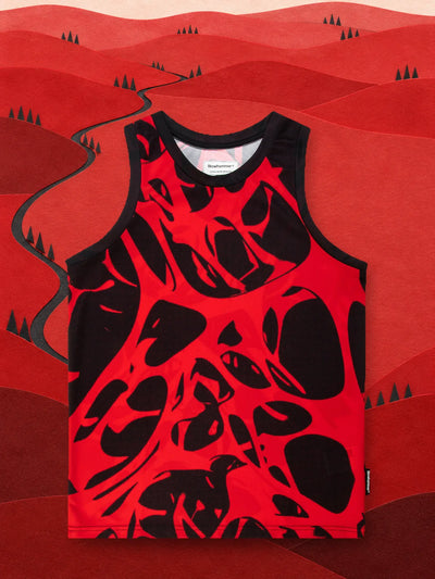 The red and black Strand Red tank top in a valley of red paper hills.
